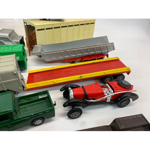 152 - A collection of model cars and trucks etc. Dinky, Corgi, Matchbox, Lesney and French makes.