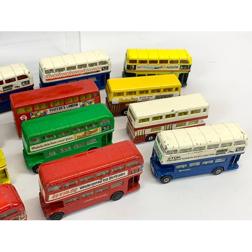 154 - A collection of model buses and tractors etc. Mostly Corgi, including 2 Lone Star tractors.