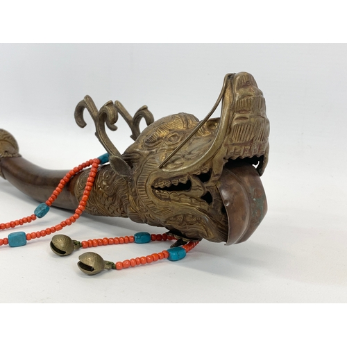 138 - An early 20th century Tibetan brass Sea Dragon Ritual Blessing Horn. 52cm