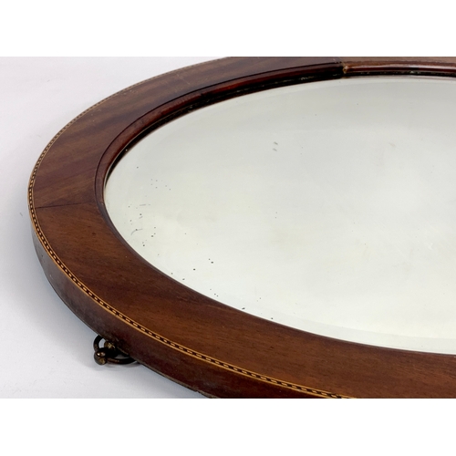 142 - An Edwardian inlaid mahogany framed mirror. 49 x 65cm