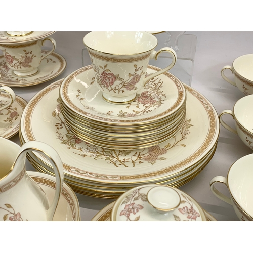 476 - A 46 piece Royal Doulton “Lisette” pattern tea and dinner set. The Romance Collection. 6 soup bowls,... 