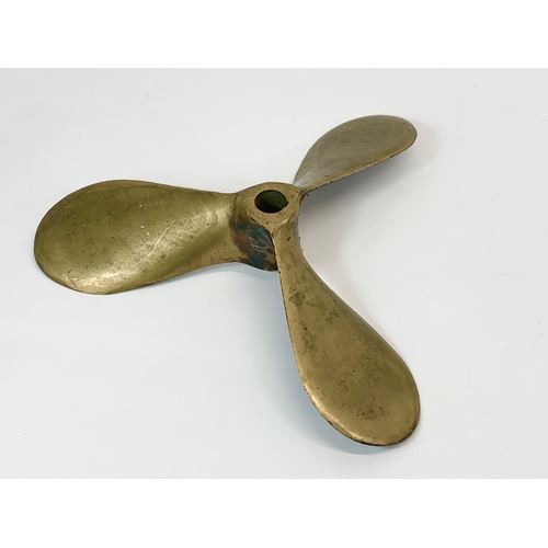 167 - A vintage brass propeller. 35cm