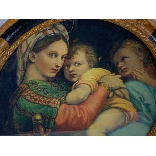 174 - A large early 20th century gilt framed religious print. Madonna and Child. 63cm