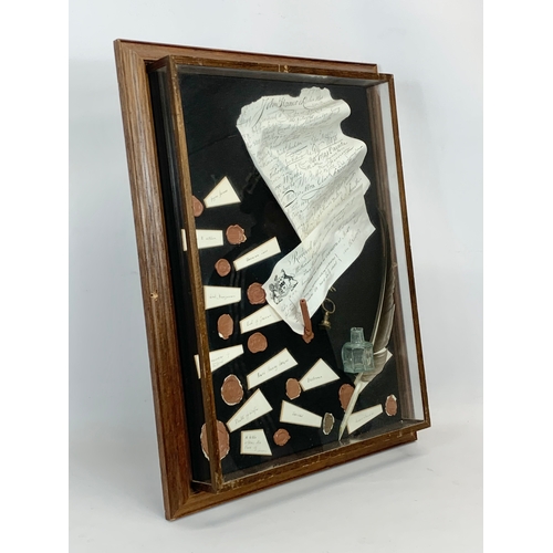 182 - A shadow box case with imitation seals etc. John Hancock. 45 x 57.5cm.