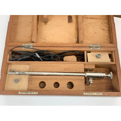 189 - 2 vintage medical instruments by Genito Urinary MFG Co LTD, in wooden cases. Gastroscope and other. ... 