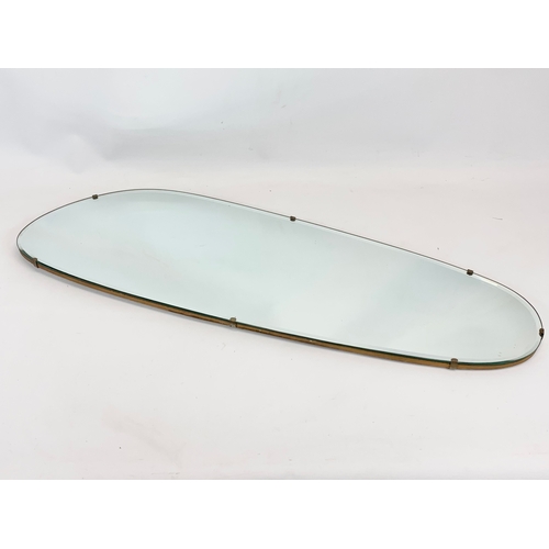 196 - A vintage bevelled mirror. 29 x 91cm