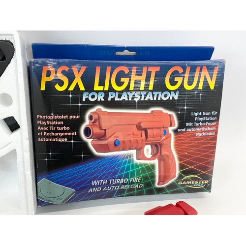 146 - An Atlas Editions model airplanes and a Gamester LMP PSX Light Gun for PlayStation.