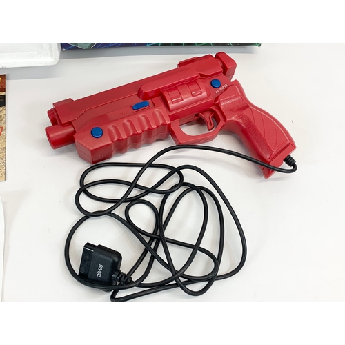 146 - An Atlas Editions model airplanes and a Gamester LMP PSX Light Gun for PlayStation.