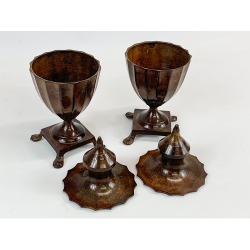 226 - A pair of 19th century bronzed spelter urns with lids. 23cm