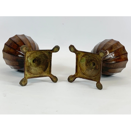 226 - A pair of 19th century bronzed spelter urns with lids. 23cm