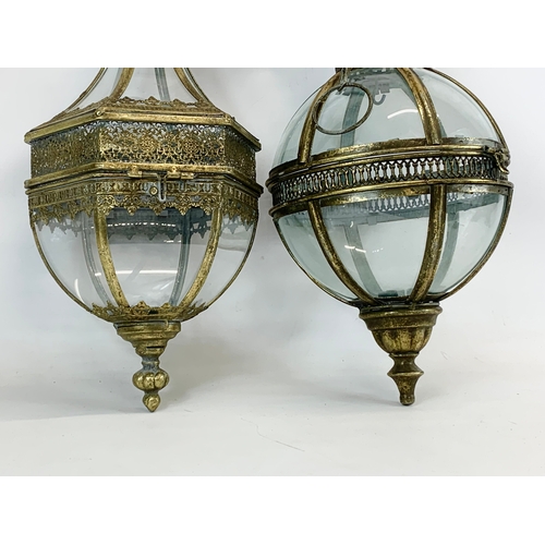 229 - 2 ornate brass hanging lanterns. 47cm