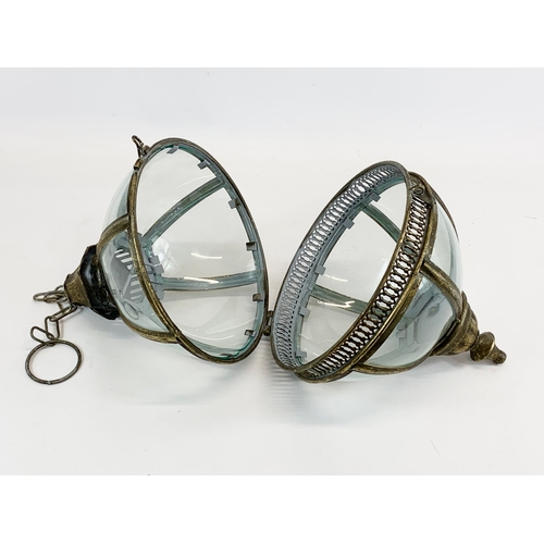 229 - 2 ornate brass hanging lanterns. 47cm