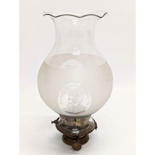 240 - An Edwardian oil lamp burner with etched glass picture of Charles Stewart Parnell. Shade is 23.5cm