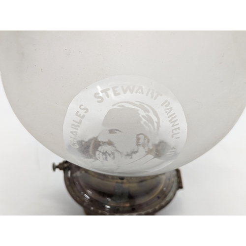 240 - An Edwardian oil lamp burner with etched glass picture of Charles Stewart Parnell. Shade is 23.5cm