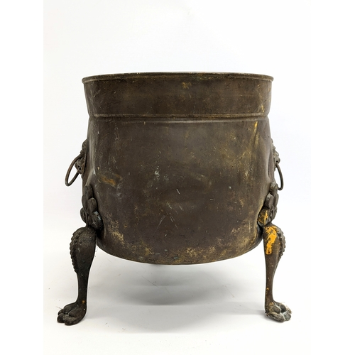 244 - An early 20th century 2 handled brass coal bucket in Regency style. 27x30cm