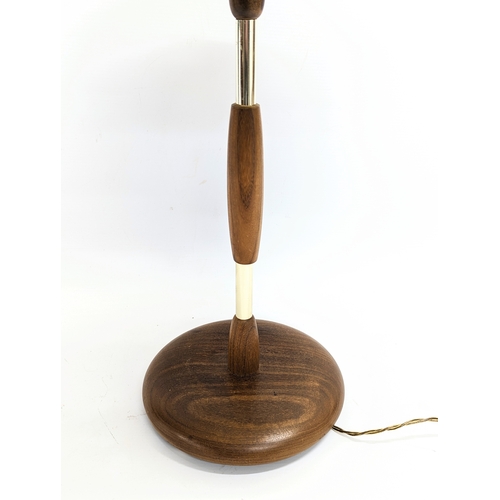 246 - A Mid Century teak lamp. 59cm including shade.