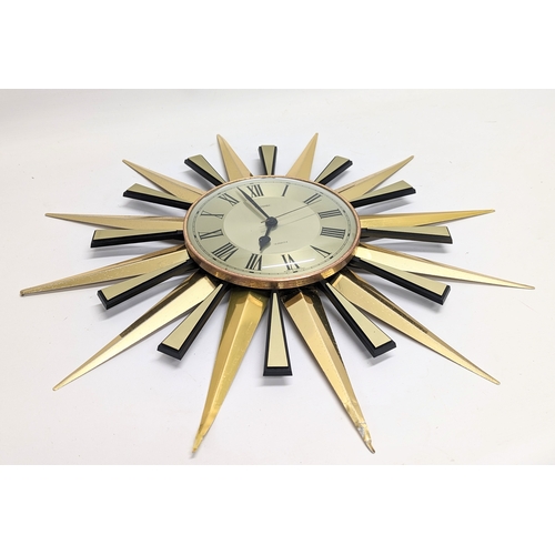 250 - A Mid Century Metamec sunburst wall clock, circa 1960s. 59cm