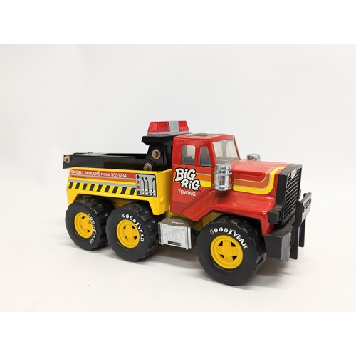 265 - 3 toys including a 1986 Remco Big Rig Towing truck, a Trans-Australia 10-wheeler made by Clover Toys... 