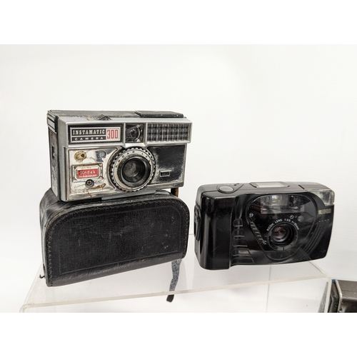 267 - A quantity of vintage cameras, accessories with a vintage Phillips tape recorder. Cameras includes a... 