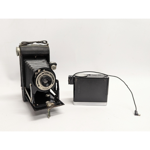 267 - A quantity of vintage cameras, accessories with a vintage Phillips tape recorder. Cameras includes a... 