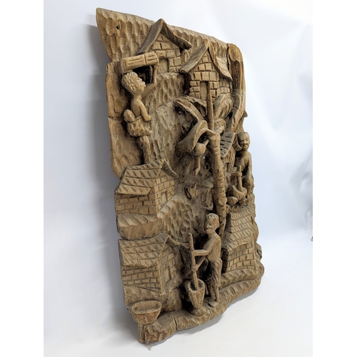 278 - A large vintage carved African walls plaque. 60x87.5cm