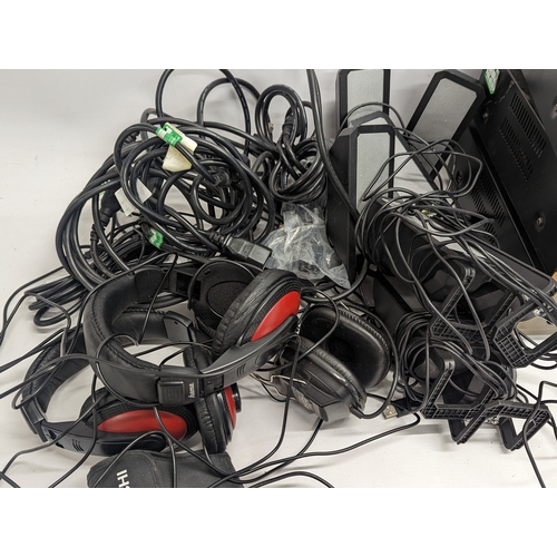 271 - A sundry lot including 3 Promethean Power Amplifiers, 3 sets of headsets, cables, speakers, and 2 bo... 