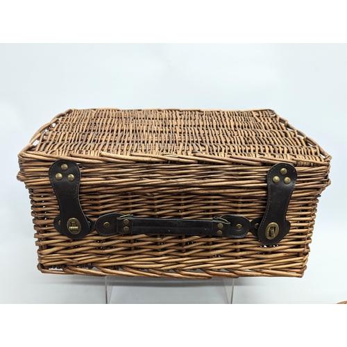 288 - A wicker picnic basket with 3 other wicker baskets