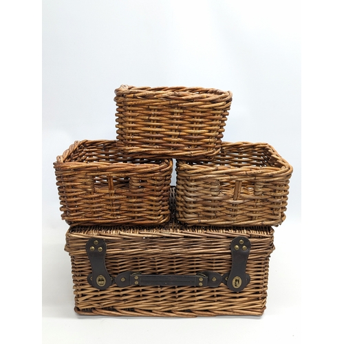 288 - A wicker picnic basket with 3 other wicker baskets