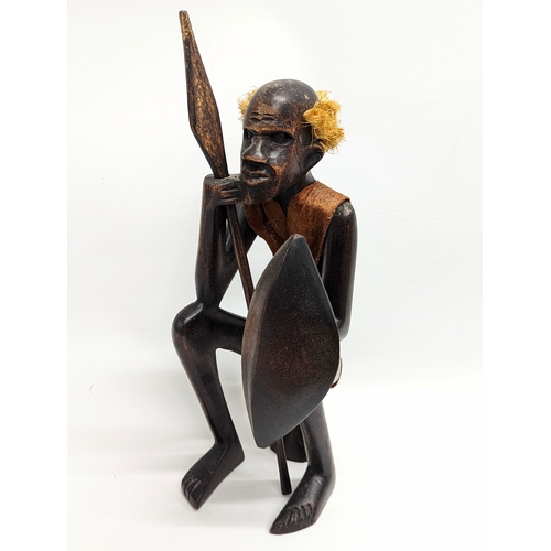 292 - An African wooden figure with animal skin