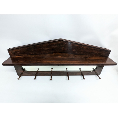 276 - A 19th century rosewood hat and coat rack. 106 x 47cm.