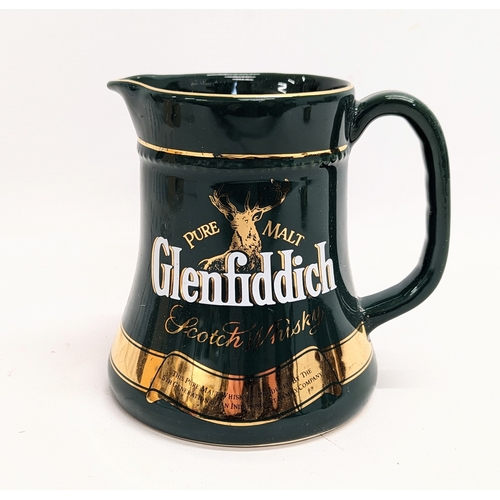 528 - A Glenfiddich Scotch Whisky pottery jug. 14.5cm