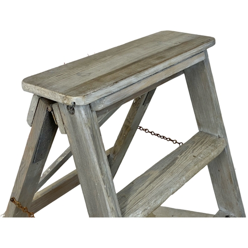 290 - A vintage pine folding step ladder. 51 x 77cm closed