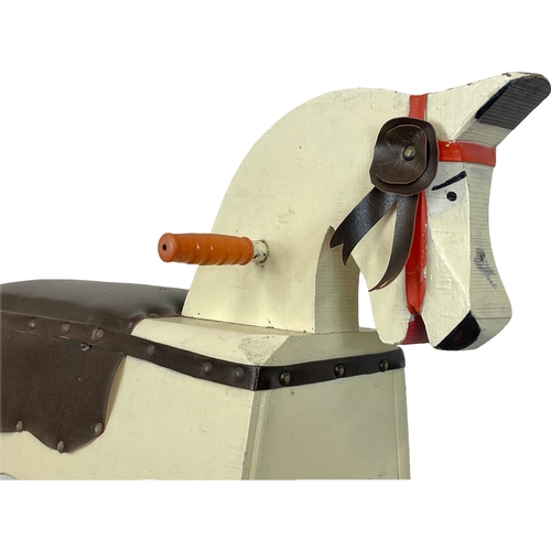 294 - A vintage child’s wooden rocking horse. 91 x 78cm