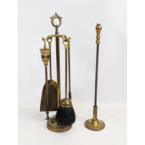 569 - A vintage brass companion set.