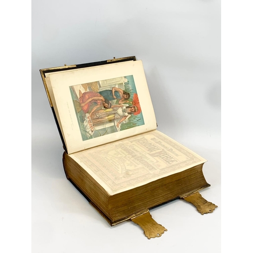 11 - A large late 19th century leather brass bound Holy Bible. 28 x 10 x 34cm