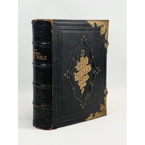 11 - A large late 19th century leather brass bound Holy Bible. 28 x 10 x 34cm