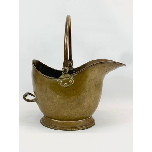 14 - A Victorian brass coal scuttle. 46 x 32 x 47cm