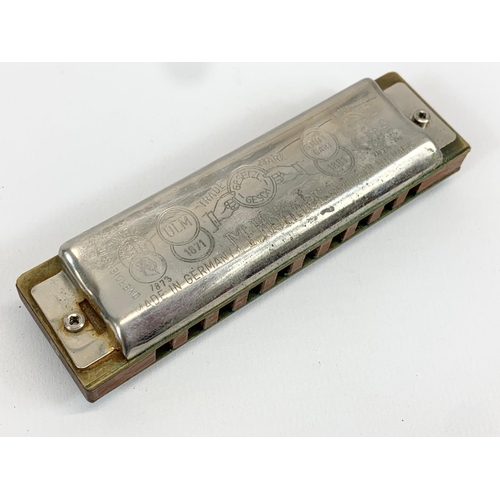 1 - 2 Hohner harmonicas in cases. Blues Bender. Marine Band.