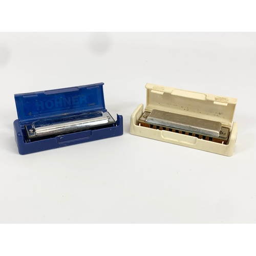 1 - 2 Hohner harmonicas in cases. Blues Bender. Marine Band.