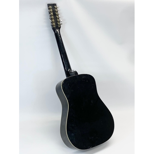 30 - A 12 string “Black Bird” guitar by Eros. 108cm