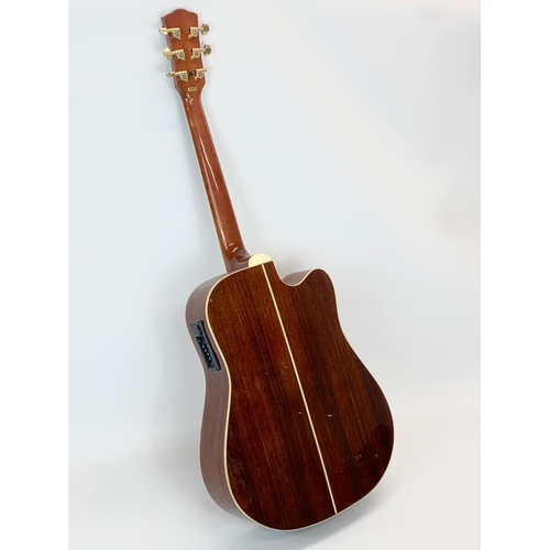 31 - A guitar by Boorinwood. 105cm