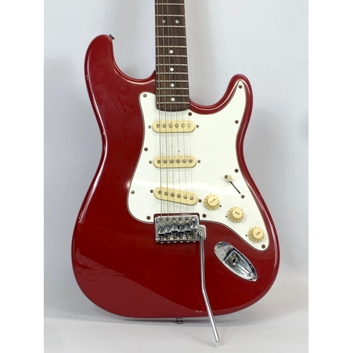 32 - An electric guitar by Mustang. Sunn. 98cm