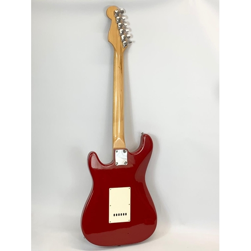 32 - An electric guitar by Mustang. Sunn. 98cm