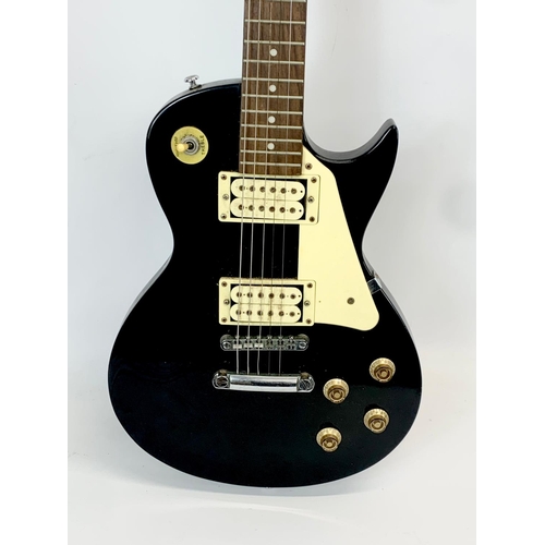 35 - An electric guitar by Encore. 100cm