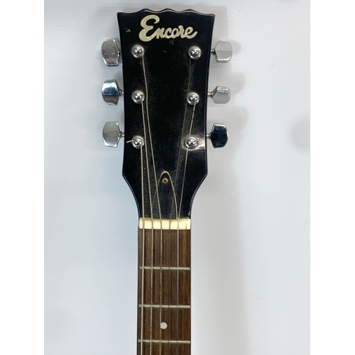 35 - An electric guitar by Encore. 100cm