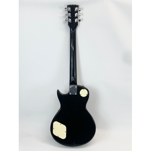 35 - An electric guitar by Encore. 100cm