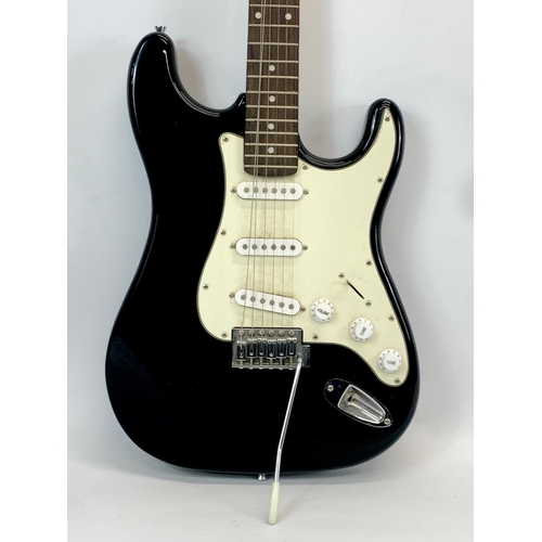 36 - An electric guitar by Burswood. 99cm