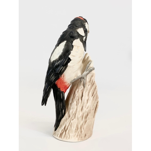 392 - A Goebel pottery woodpecker figure. 18cm