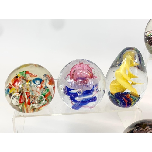 394 - A collection of Art Glass paperweights. Largest 10 x 9cm.