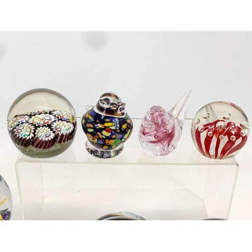 394 - A collection of Art Glass paperweights. Largest 10 x 9cm.